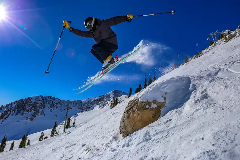 Park City skiier going off a jump in the air
