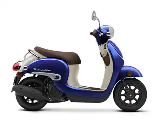 Couple on a scooter near the beach