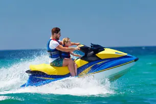 Father and son on jet ski