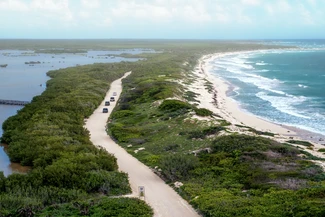 Jeeps driving along the coast to Punta Sur park in Cozumel